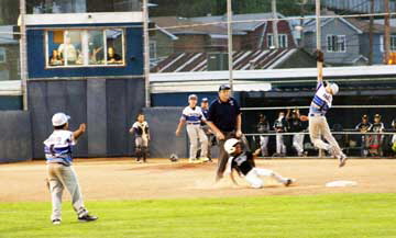 Sal Garcia leaps to catch the erant throw.  Thankfully third base was backing up the throw to stop the runners from advancing